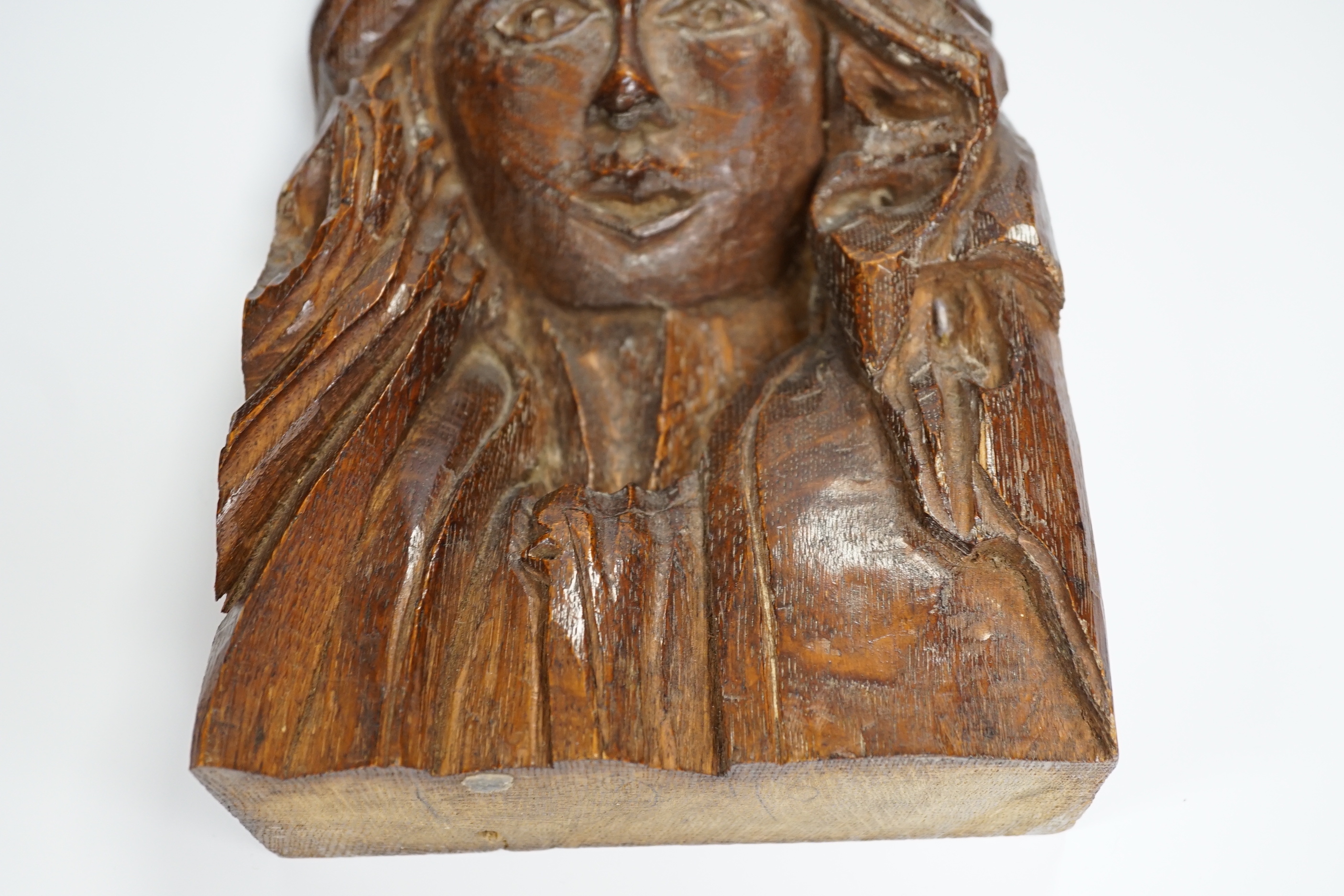 A small carved oak figure of a maiden, 28cms high